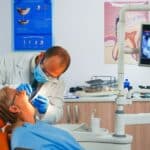 dentist putting dental crown