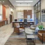 a modern dental office with state-of-the-art equipment and a skilled dentist performing a dental implant procedure in tyler, tx.