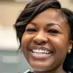 a smiling patient in tyler, texas showcasing their affordable and high-quality dental implants.