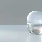 a close-up of a shiny dental implant with an abutment and veneer, showcasing its durability and aesthetic appeal in a tyler dental clinic.