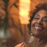 a radiant and inviting dental clinic in lake worth, showcasing a smiling patient confidently wearing a sleek implant-supported denture, illuminated by soft, warm lighting that highlights the modern features and benefits of the treatment.