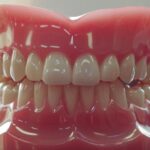 a radiant smile showcases flawless, lifelike dental implants against a backdrop of a serene dental office, with soft, natural lighting highlighting the teeth's pristine details.