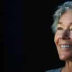 a radiant smile showcasing flawless dental implants, illuminated by soft, natural light to emphasize the transformation and enhanced well-being.