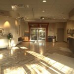 a serene dental clinic in fort worth, featuring a bright, inviting treatment room with advanced equipment and a calming atmosphere, symbolizing hope and recovery after a dental implant mishap.