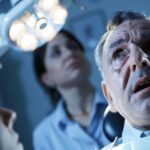 a dramatic close-up of a dental clinic, showcasing an anxious patient in the examination chair under bright overhead lights, while a concerned dentist discusses the potential risks of tooth extraction, including the implications for heart health, captured with a shallow depth of field for emphasis.
