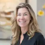 a radiant smile showcasing a flawless set of dental implants gleams against a serene clinic backdrop, emphasizing the transformative power of enhanced oral health.