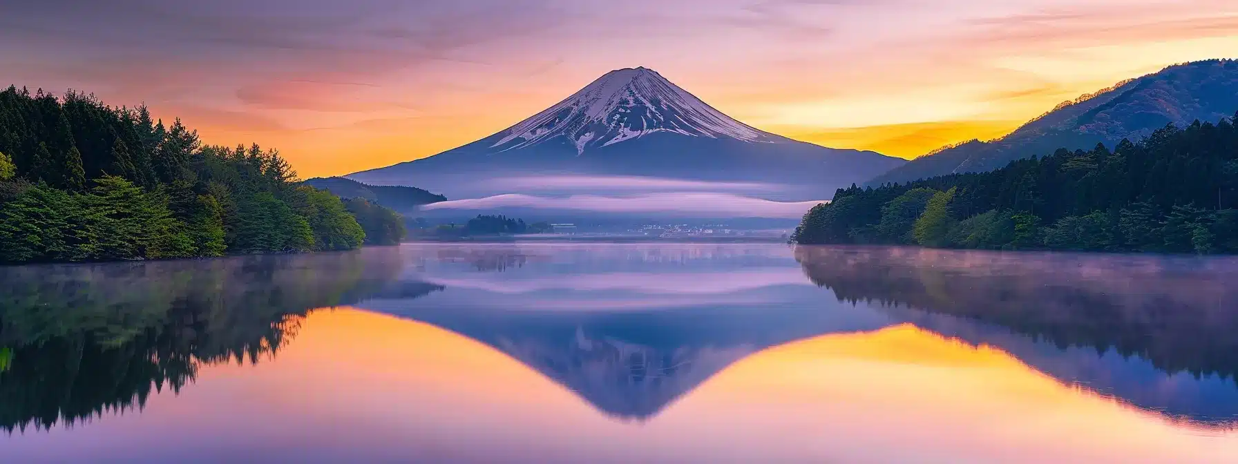 a majestic mountain landscape at dawn, with vibrant hues of orange and purple reflecting off a serene lake, surrounded by lush evergreen trees and a soft mist rising from the water.