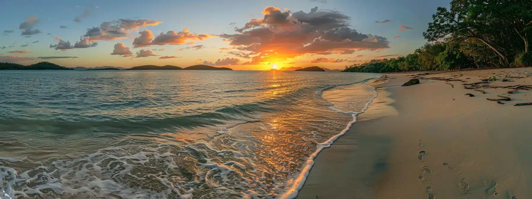 a vibrant sunset casts a golden glow over a tranquil beach, where gentle waves lap against the shore, creating a peaceful atmosphere that invites serenity and reflection.