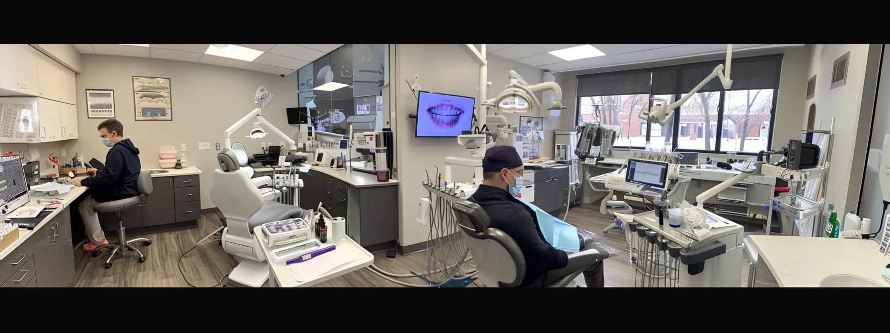 a focused dental office scene captures a dentist expertly fitting immediate dentures on a patient in an ergonomic dental chair, surrounded by advanced dental equipment and detailed impressions displayed on a nearby counter.