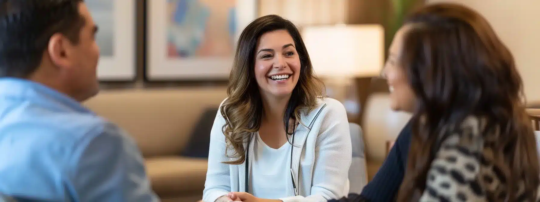 a warm, inviting dental clinic in tyler, texas, features smiling patients sharing their transformation stories in a modern consultation room, showcasing the emotional uplift and satisfaction of regaining their smiles through dental implants.