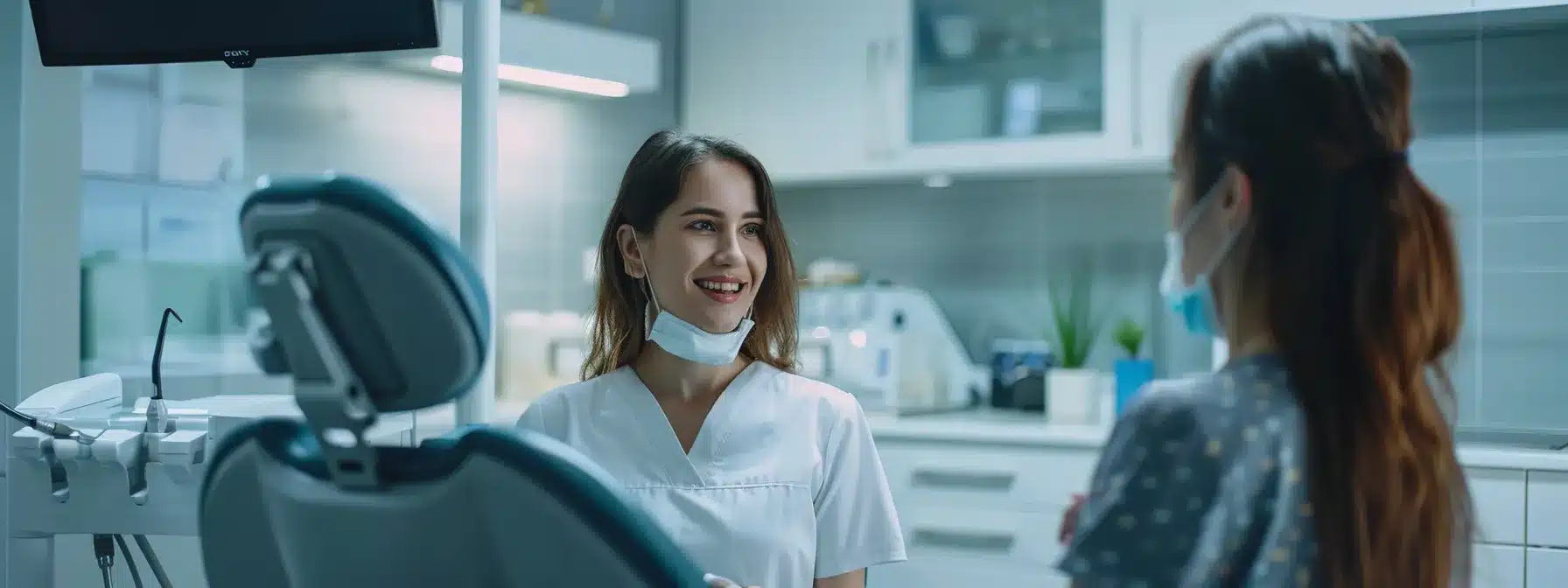 an inviting dental consultation room, elegantly arranged with modern equipment and soft ambient lighting, captures a professional dentist attentively discussing treatment options with a patient, emphasizing a collaborative and informed decision-making atmosphere.