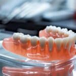 Illustration depicting benefits of permanent soft liners for dentures and oral comfort.