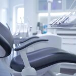 a modern dental clinic, featuring a sleek treatment chair and advanced technology, where a confident patient smiles brightly, showcasing the transformative results of dental implants against a backdrop of clean, high-tech instruments and soft, ambient lighting.