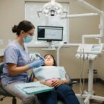 a bustling dental clinic in cleburne, texas, featuring a friendly dentist consulting with a patient in a modern, well-lit examination room, emphasizing comfort and professionalism in affordable oral care solutions.