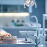 a close-up view of a sophisticated dental office, featuring a modern dental chair and detailed anatomical models of dentures, with focused lighting highlighting the intricate per arch structure.