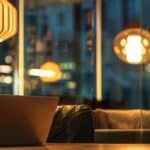 a modern urban office space in tyler, texas, featuring a focused individual intently reviewing a digital payment plan on a sleek laptop, illuminated by bright overhead lights, conveying a sense of determination and financial empowerment.