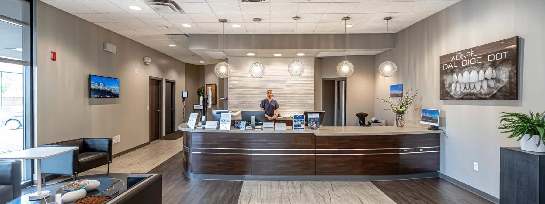 a modern dental clinic in tyler, tx, showcasing a friendly dentist engaging with a patient, surrounded by informative brochures about dentures and implants on a sleek reception desk.