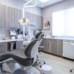 a modern dental clinic in lake worth showcases a sleek, state-of-the-art operatory with advanced equipment and a patient chair, emphasizing the precision and professionalism of dental implant revision procedures.