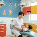 Family-friendly dental clinic with a dentist and child, highlighting affordable dental care in Keller, Texas