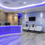 a modern dental clinic in lake worth features a bright, welcoming reception area with sleek furnishings and advanced dental technology, embodying a commitment to affordable and high-quality dental care for patients seeking implants and dentures.