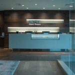 a modern dental office in mansfield, tx, showcases a sleek consultation area with a detailed display of custom dentures, highlighting the craftsmanship and technology involved in restoring smiles for patients in their 40s to 60s.