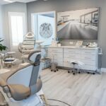 a sleek, modern dental clinic in lake worth, featuring advanced dental technology, pristine treatment rooms, and a confident patient consulting with a professional dentist about the innovative benefits of titanium dental implants.