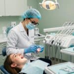 Dental examination for gingival recession treatment in a modern clinic