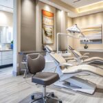 a modern dental clinic interior showcases a patient in a high-tech dental chair, visibly relaxed with soothing colors and soft lighting, highlighting the importance of understanding healing sensations after dental implant procedures.