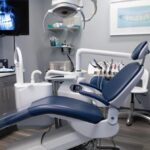 a modern dental clinic showcases a radiant patient smiling confidently while seated in a sleek, high-tech dental chair, surrounded by advanced equipment that emphasizes the seamless journey to achieving a natural-looking smile through dental implants.