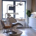 a modern dental clinic setting features a confident patient discussing dental implant options with a skilled surgeon, illustrating the balance of advanced technology and the importance of expert advice in ensuring successful oral health outcomes.