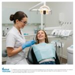 Smiling patient consulting with a dentist about dental veneers in a modern dental clinic