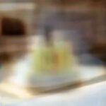 Dental implant model on a dental office countertop, showcasing the fixture and crown