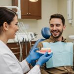 Smiling patient consulting with a dentist about dental implants in a modern dental office