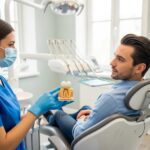 Dental consultation on tooth extraction aftercare with a dentist and patient