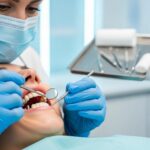 Dental professional examining mini dental implants in a modern clinic
