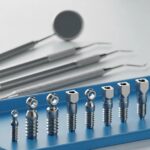 Close-up of mini dental implants on a dental tray in a professional dental setting