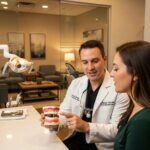 Dental consultation about implant costs in a welcoming dental office