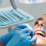 Close-up of a dental professional examining mini dental implants in a modern clinic
