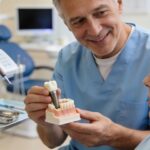 Dental professional discussing implant costs with patient in clinic