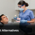 Dental implants use biocompatible titanium posts surgically placed into the jawbone to support a custom
