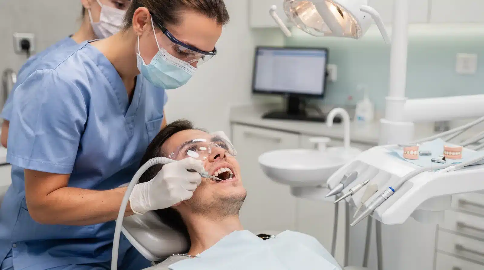 Endosteal implants replace a missing tooth's root with a small screw-shaped post placed directly